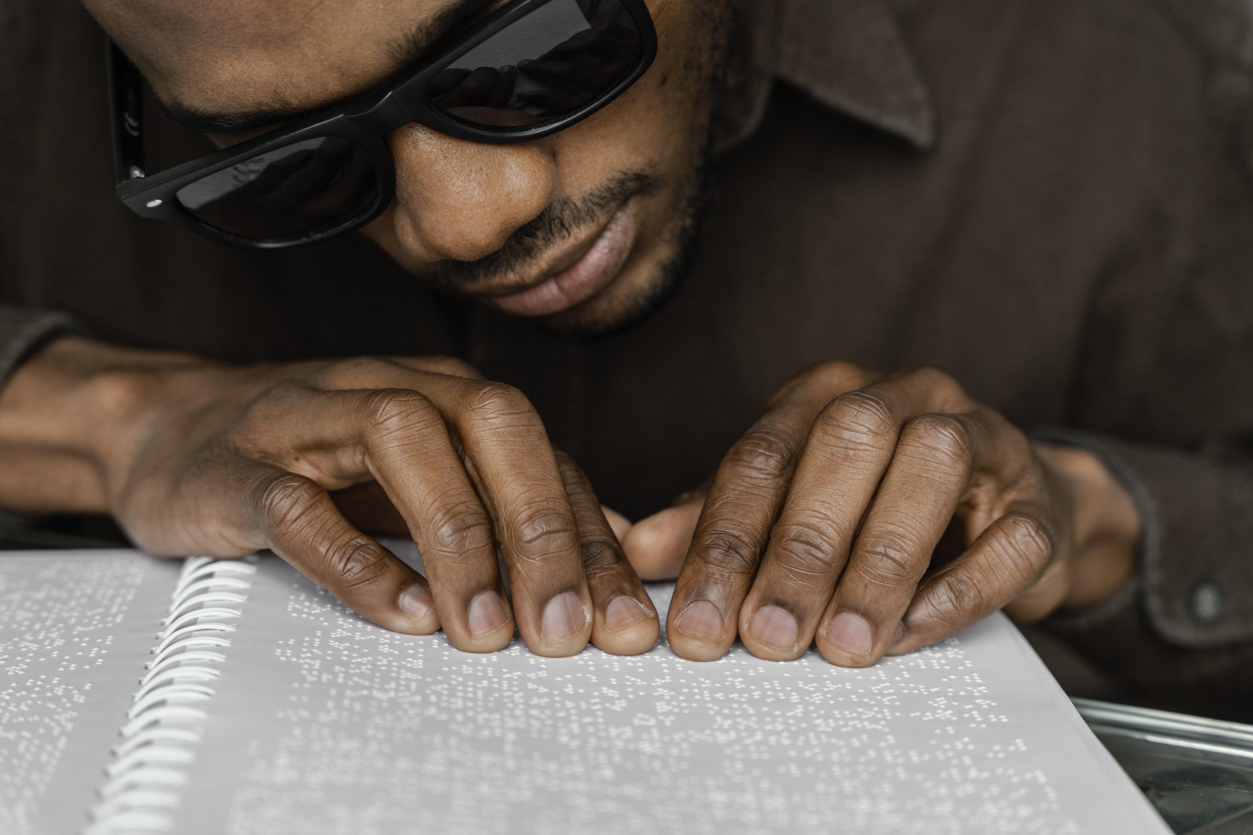 blind-man-reading-braille